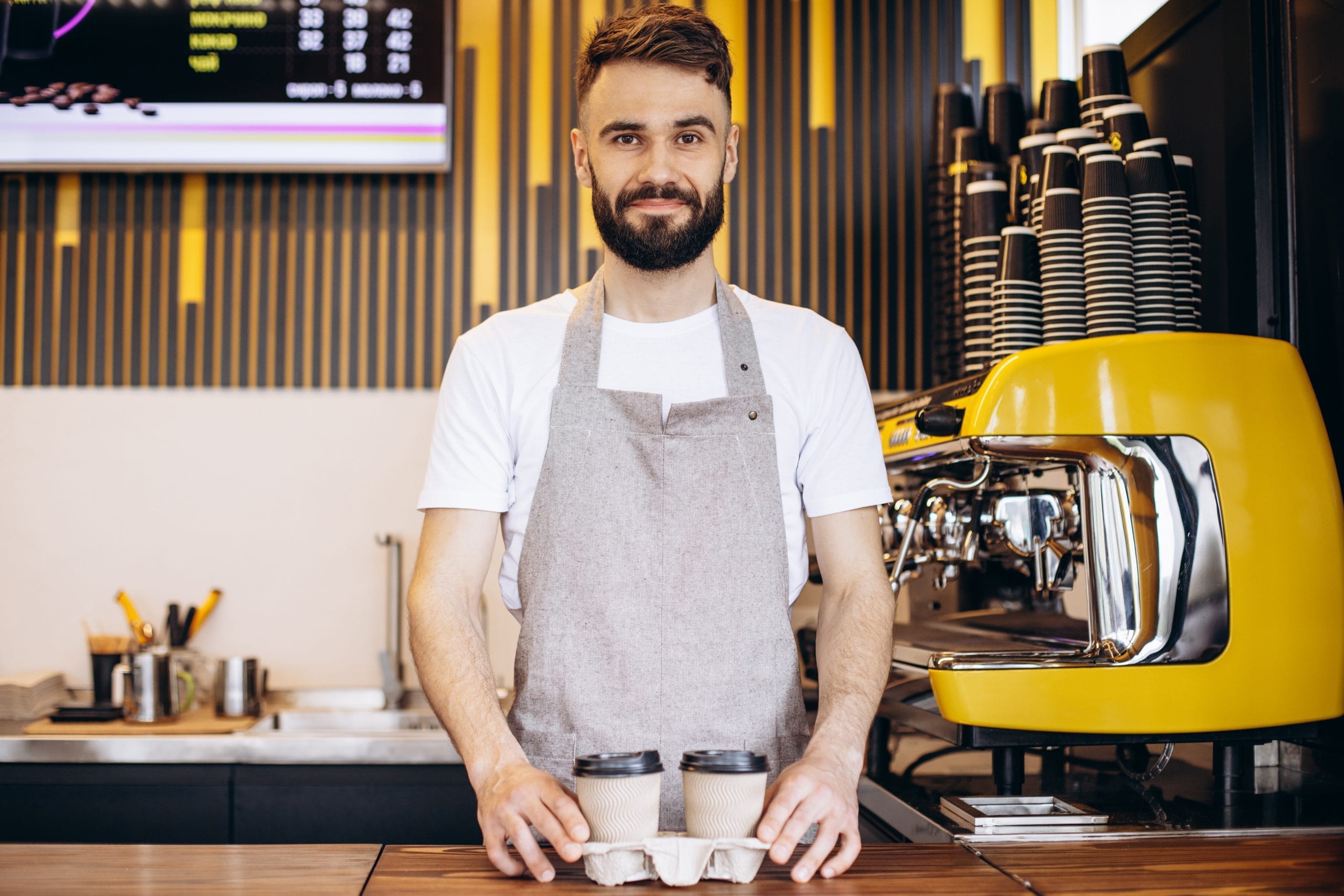 male barista serving coffee cardboard cups scaled Kantin İşletme Sertifikası Nasıl Alınır?