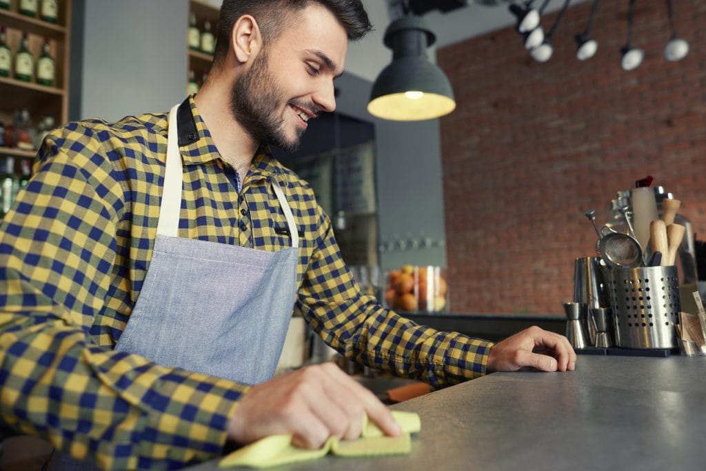 waiter cleaning bar counter before work Kantin İşletme Sertifikası Nasıl Alınır?