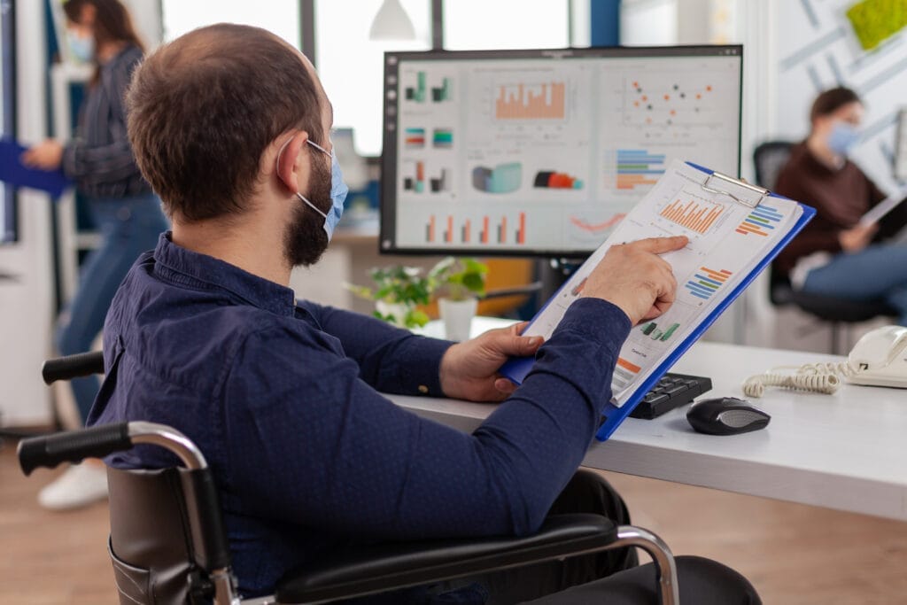 handicapped entrepreneur with protective face mask working new normal business financial company checking project documents Bilgisayar İşletmenliği Sertifikası Nasıl Alınır?