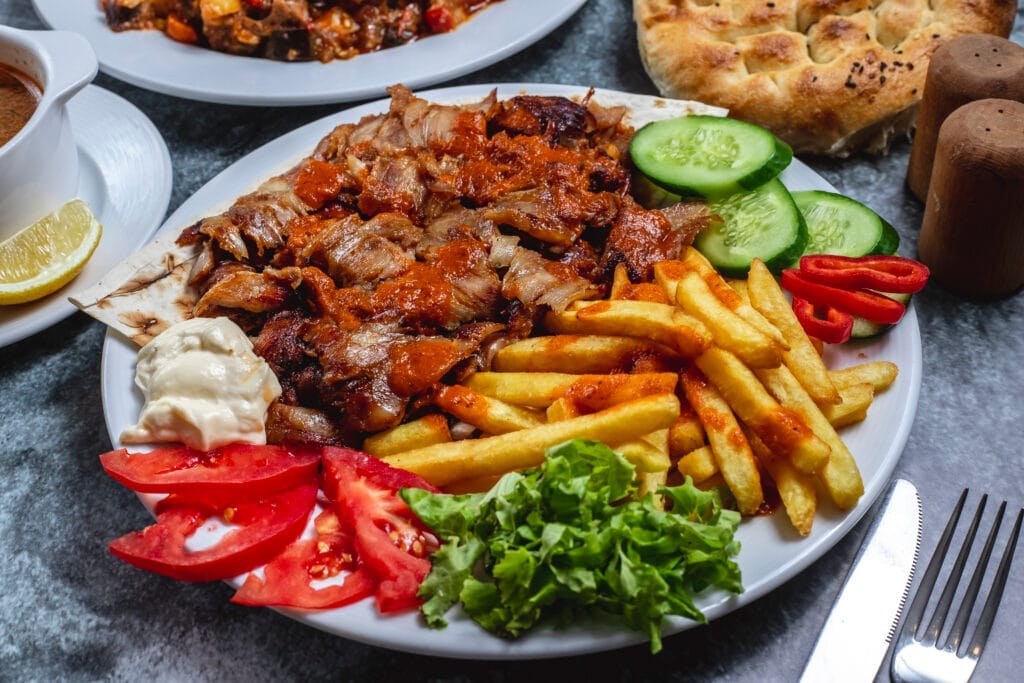 side view doner plate with french fries tomato fresh cucumber yogurt bread table Kantincilik Belgesi Nasıl Alınır