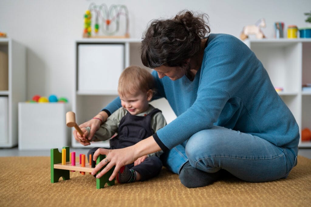full shot woman kid playing Çocuk Bakım Elemanı Sertifikası Nasıl Alınır? -