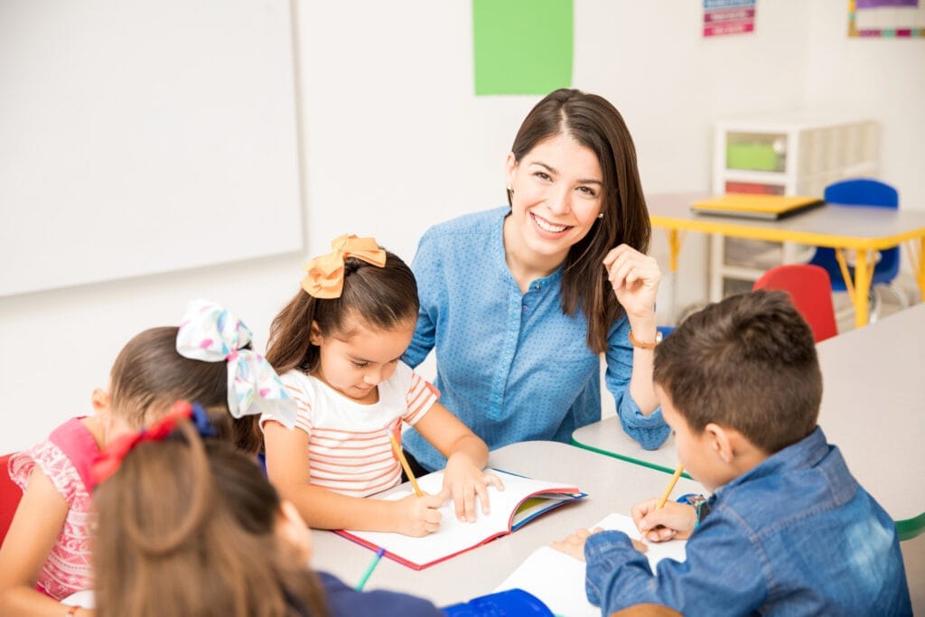 portrait gorgeous hispanic preschool teacher teaching her students classroom portrait gorgeous hispanic preschool teacher teaching her students classroom