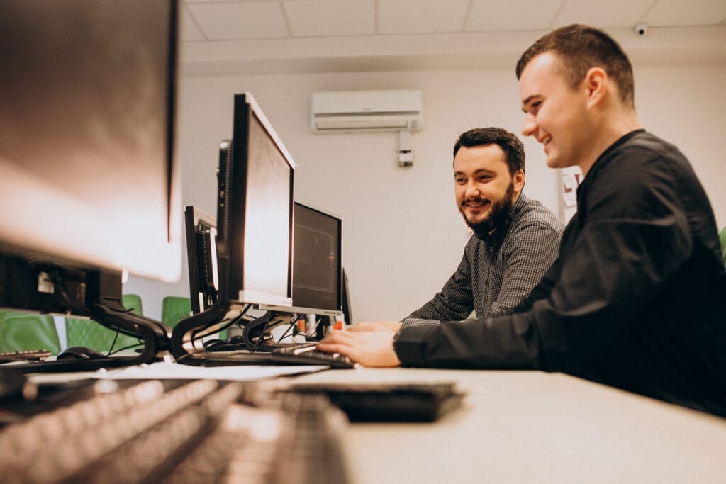 young male web designers working computer Bilgisayar İşletmenliği Operatörlüğü Nedir