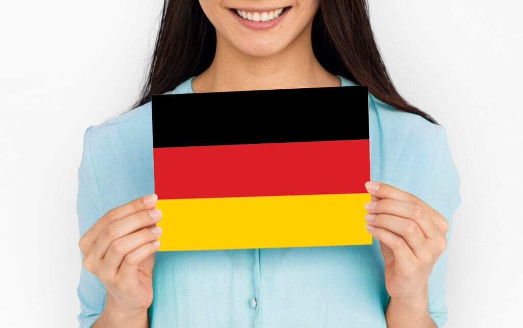 woman hands hold germany deutschland flag patriotism Almanca A1 A2 Eğitim Sertifikası