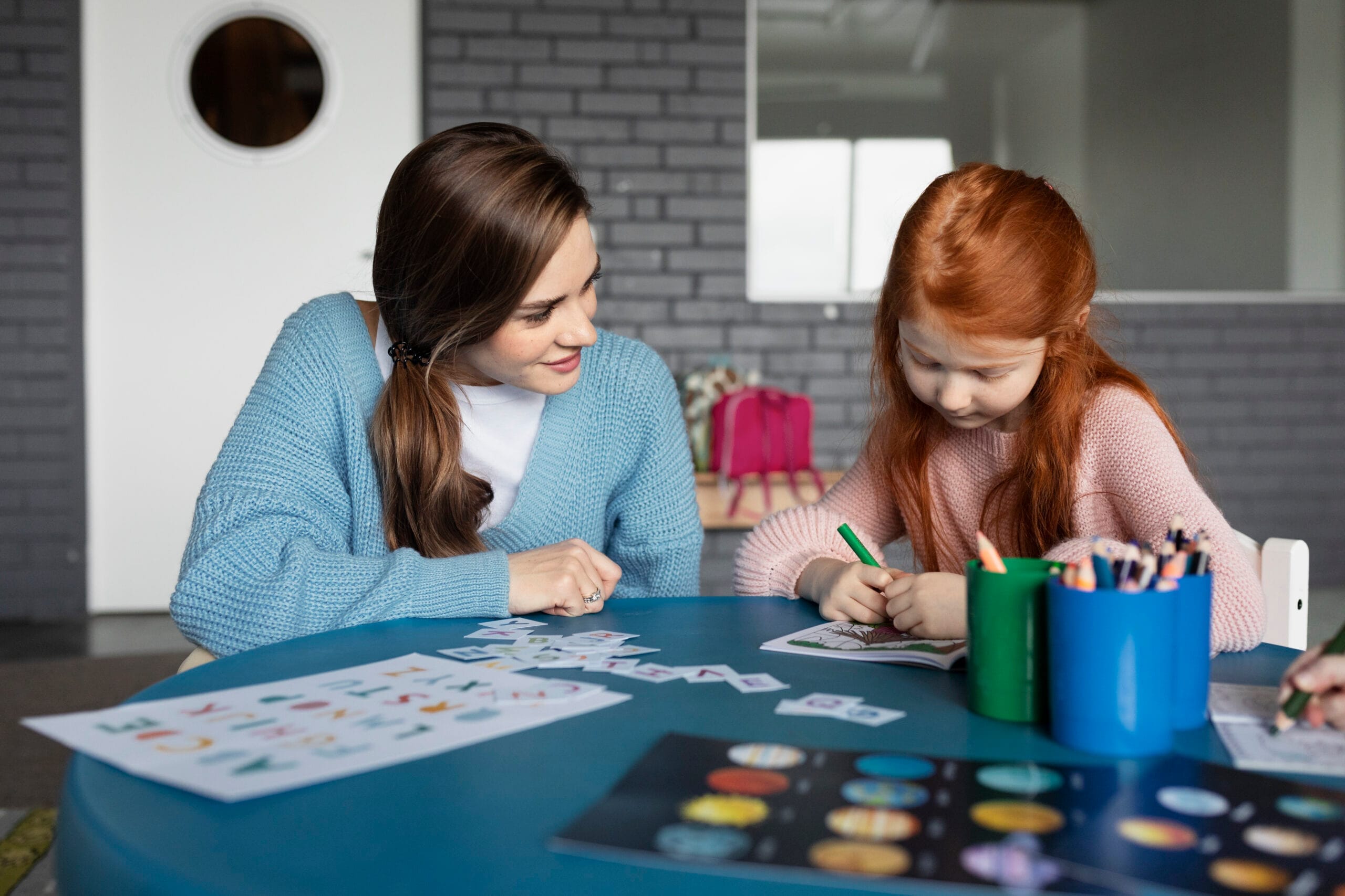 medium shot girl coloring table scaled Özel Eğitim Belgesi Nereden Alınır?